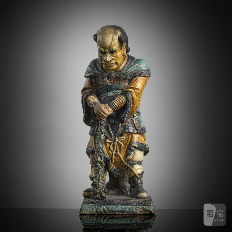 A 'fahua' ceramic figure of a lokapala leaning on a club